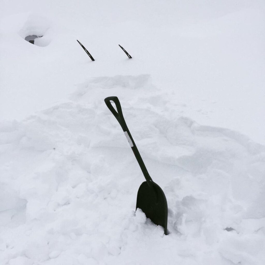 Car completely buried in snow
